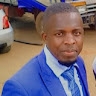 BRIAN OKISO